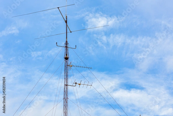 Fototapeta High Antenna Mast on Building: Broadcasting and Telecommunication Technology