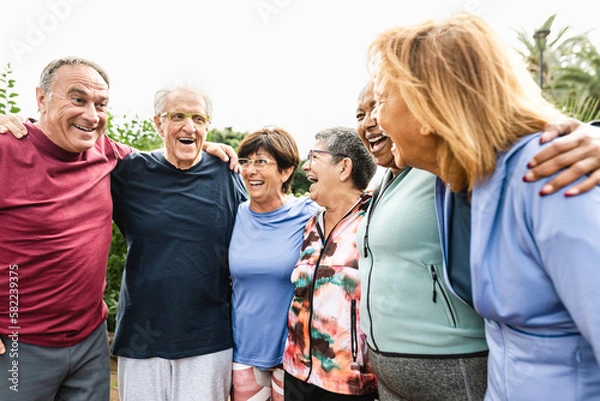 Obraz Group of diverse senior friends having fun after workout session at park