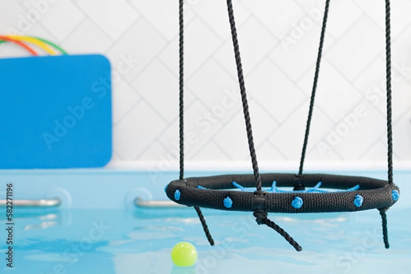 Fototapeta Children's swimming pool with various items. Selective focus.