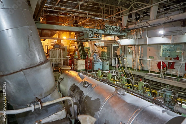 Obraz Ship's engine room. Vessel's ( Ship ) Engine Room Space / industrial stairs. Ship's Engine Heavy Machinery Space - Pipes, Valves, Engines