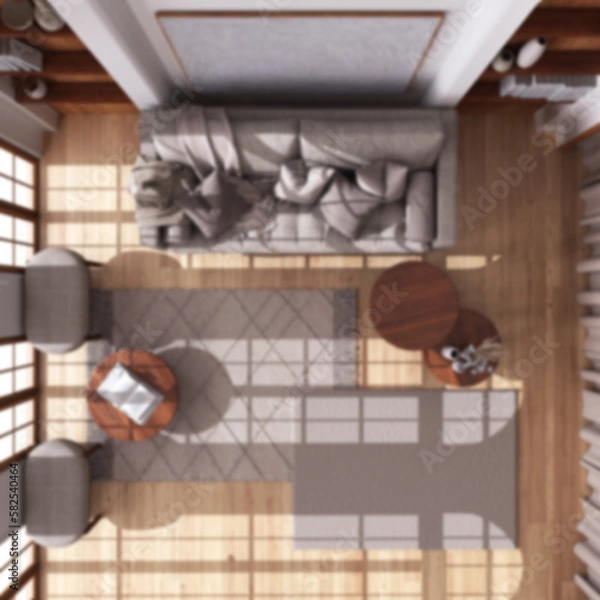 Fototapeta Blurred background, wooden living room in boho style with parquet floor. Fabric sofa, carpet and tables. Bohemian interior design. Top view, plan, above