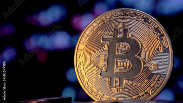 Obraz Bitcoin money on a blurry digital background