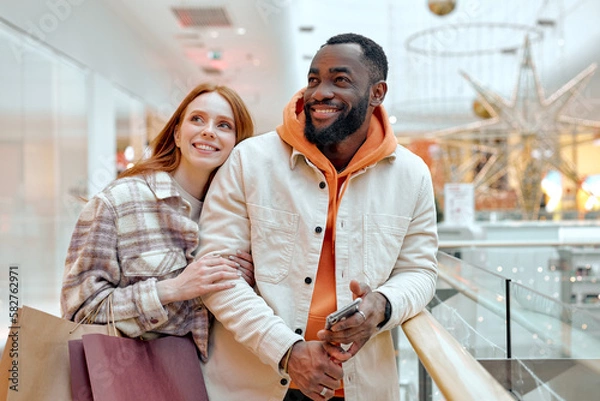 Obraz happy buyers enjoys time at mall. Ecommerce And Shopaholism, happiness, positive emotions in shopping process.interesting experience