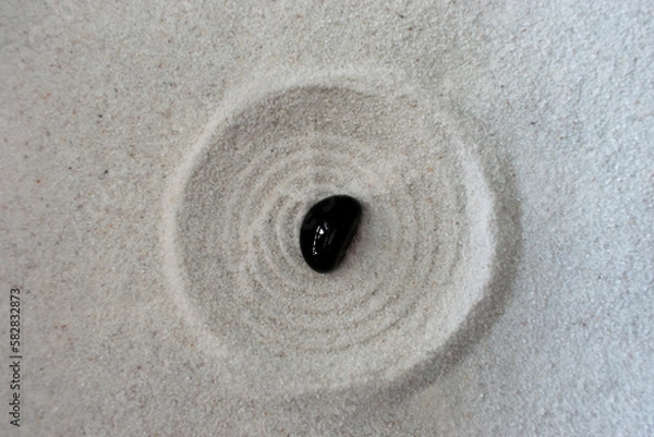 Obraz black stone in sand circle