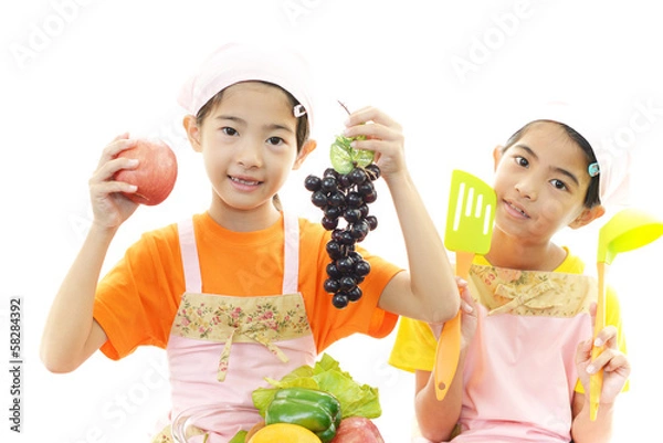 Fototapeta 果物を持つ二人の女の子