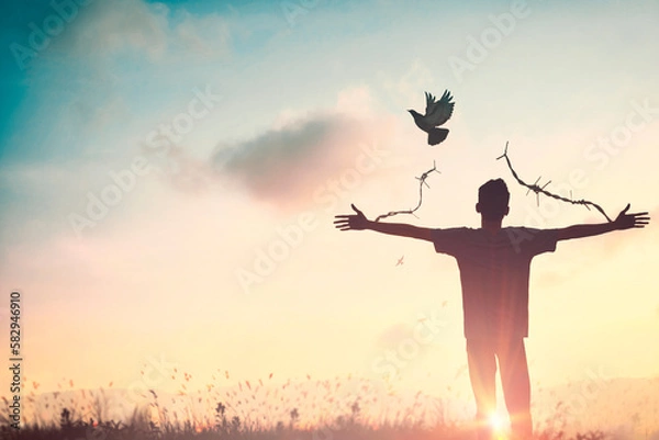 Fototapeta Happy man rise hand on morning view. Christian inspire praise God on good friday background. Now one man self confidence on peak open arms enjoying nature the sun concept world wisdom fun hope