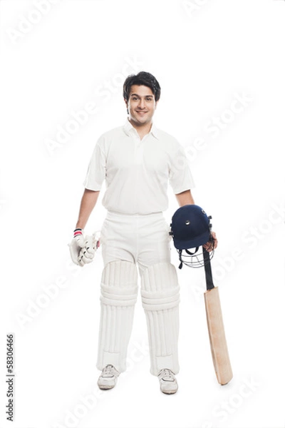 Obraz Batsman holding a cricket bat with sports helmet and smiling