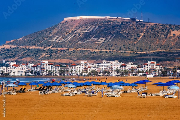 Fototapeta The beach at Agadir looking towards the Agadir Oufla