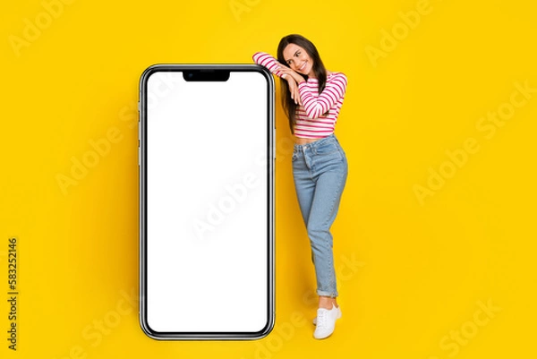Obraz Photo of pretty lady interested look booking delievery service present big device panel empty space isolated on yellow color background