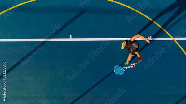 Obraz Drone Shot of Young Female Tennis Player on a New Court