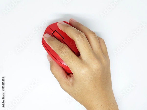 Fototapeta Hand holding red wireless mouse isolated on white background