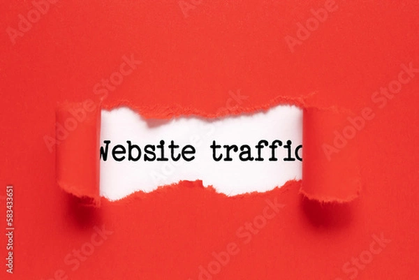 Obraz Memo note written with text WEBSITE TRAFFIC on red background.