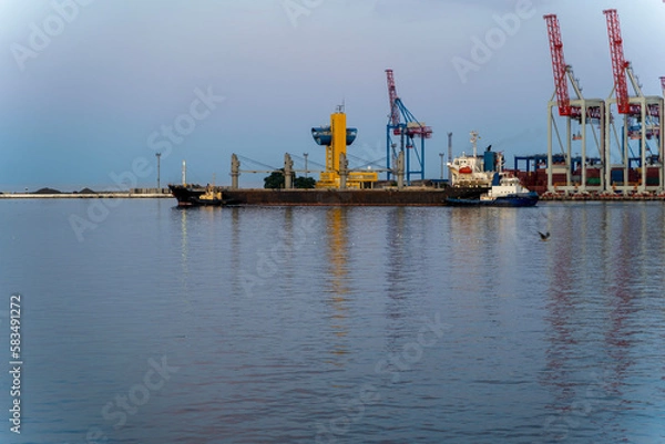 Obraz bulk carrier vessel is sailing in the port area.