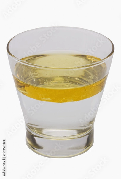 Obraz Oil floating on water surface in a glass