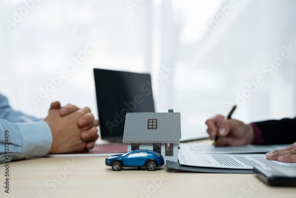 Obraz Businessman, insurance salesman reading and checking information Details in the offer contract to buy a house or rent a village project, a car housing safety concept.