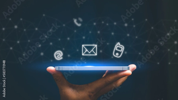 Fototapeta Woman hand using smart phone, Contact us connection concept. Contact us or Customer support hotline people connect. virtual screen contact icons ( email, address, live chat, internet wifi ).