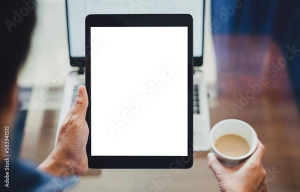 Fototapeta Vertical tablet mockup for advertising. Mock up tablet on businessman hand holding and using with blank white screen copy space for text advertisement.