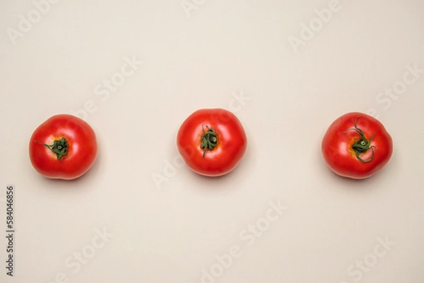 Fototapeta Red Tomatoes fresh organically grown on white background. Cool minimal flat lay, copy space