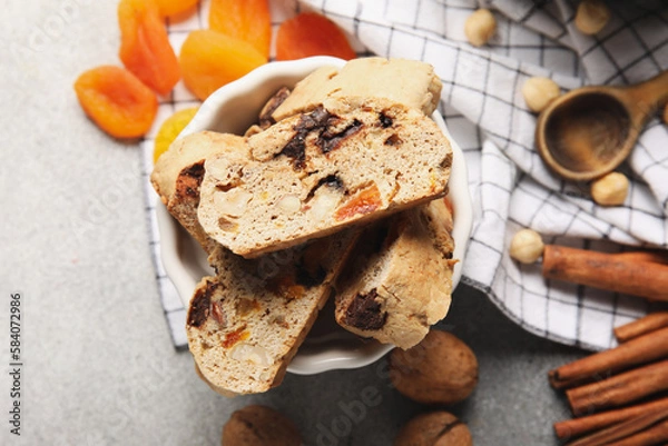 Obraz Bowl with delicious biscotti cookies on grunge background, closeup