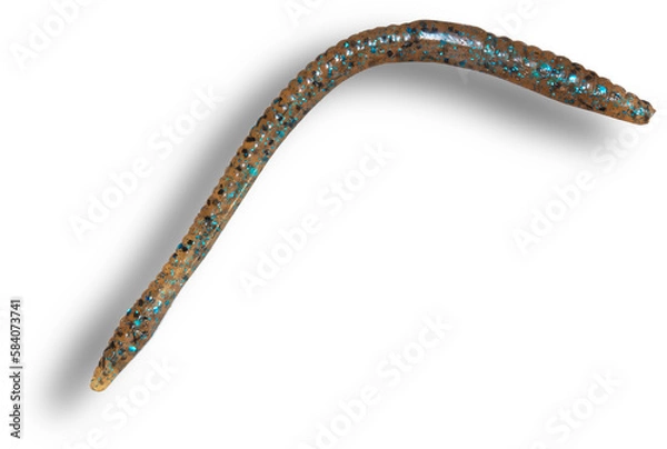 Fototapeta shadow behind a rubber fishing worm with tan color and colorful specks inside