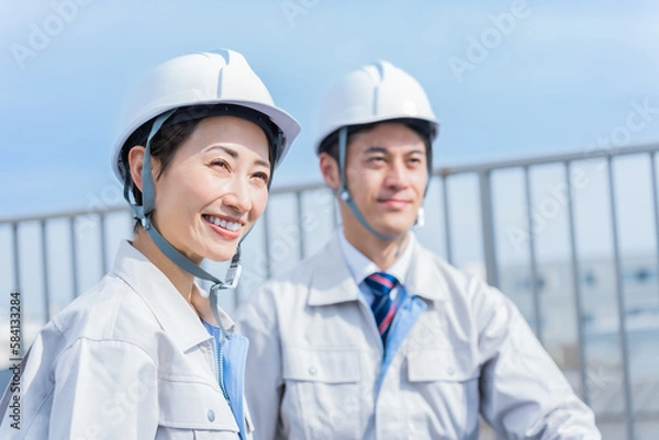 Fototapeta ヘルメットを被った日本人男女