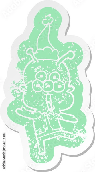 Fototapeta happy cartoon distressed sticker of a alien dancing wearing santa hat
