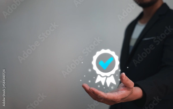 Fototapeta Certification and Guarantee of Quality Concept, businessman holding sign of certification or winning award of quality assurance