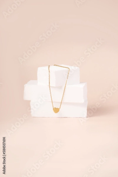Obraz heart necklace on a beige background