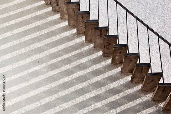 Fototapeta Staircase with shadow on the wall