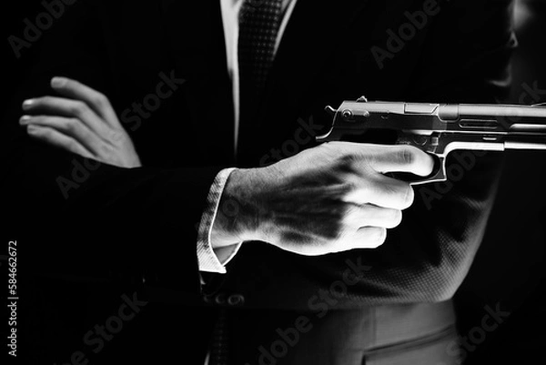 Obraz Elegant man holding gun