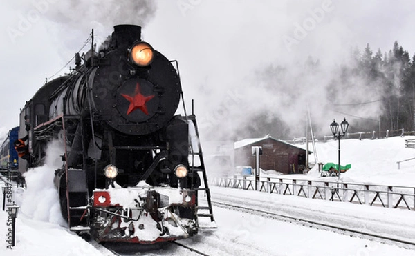 Obraz A steam locomotive with passenger train