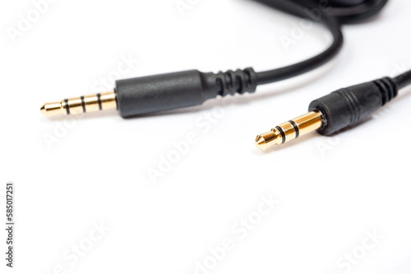 Fototapeta Black cord with a mini jack for connecting various gadgets, shot on a white background.