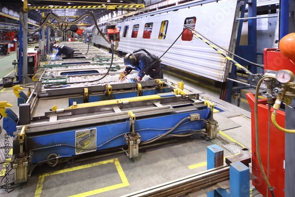 Obraz The process of welding body of the wagon by worker