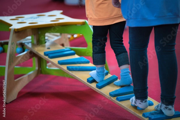 Fototapeta child playing in the playground  learning movement sibling skill therapy pursuit athletic brave colour concentration daughter exercising exploration fit fitness move practice preschooler prevention 