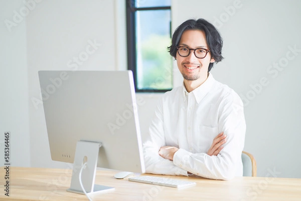 Obraz 自宅でリモートワークをする若い男性