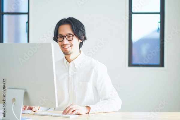 Obraz 自宅でリモートワークをする若い男性