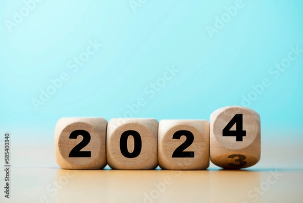 Fototapeta Flipping of 2023 to 2024 on wooden block cube for preparation new year change and start new business target strategy concept.