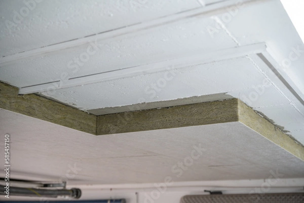 Fototapeta Insulation panels made of mineral wool, which were glued under a basement ceiling