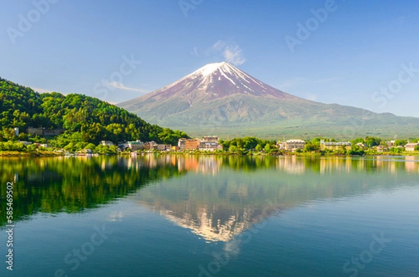 Fototapeta View of Lake Kawaguchiko with Mt Fuji in the background and its reflection. On a clear blue sky during spring season in Japan