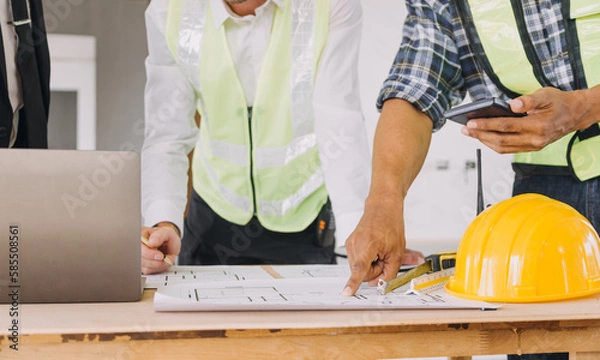 Obraz Diverse Team of Specialists Use Tablet Computer on Construction Site. Real Estate Building Project with Civil Engineer, Architect, Business Investor and General Worker Discussing Plan Details.