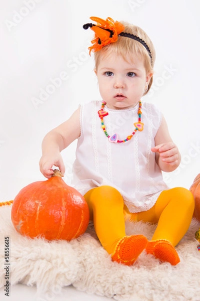 Fototapeta Baby girl with pumpkin