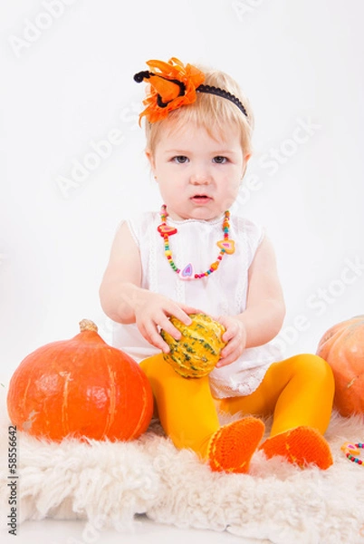 Fototapeta Baby girl with pumpkin