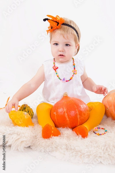 Fototapeta Baby girl with pumpkin