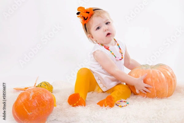 Fototapeta Baby girl with pumpkin