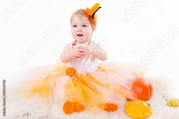 Fototapeta Baby girl with pumpkin