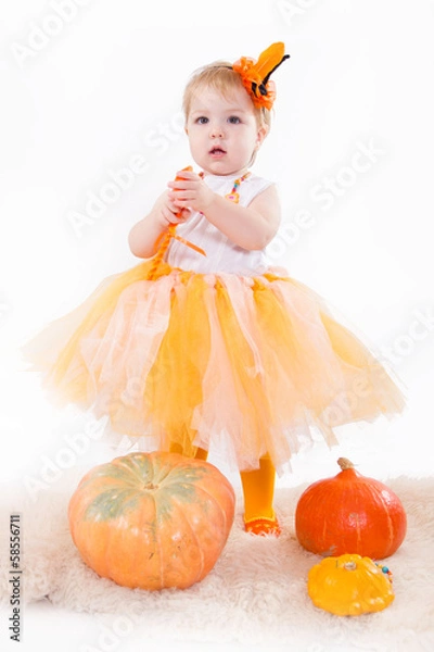Fototapeta Baby girl with pumpkin