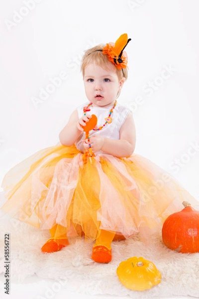 Fototapeta Baby girl with pumpkin