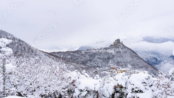 Obraz Image of the Ancient/ Abbey of San Michele built on Mount Pirchiriano located at the entrance of the Susa Valley, around the years between 983 and 987 A.D. with an abundant snowfall