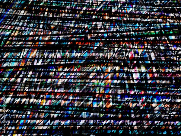 Obraz dramatic black pattern with colorful facets like glowing glass windows on a large building