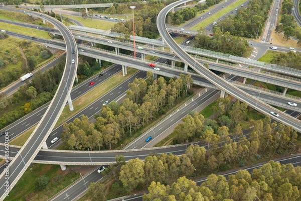 Obraz Aerial view of blurred traffic at the Light Horse Interchange junction of M4 and M7 motorways at Eastern Creek in western Sydney, Australia.